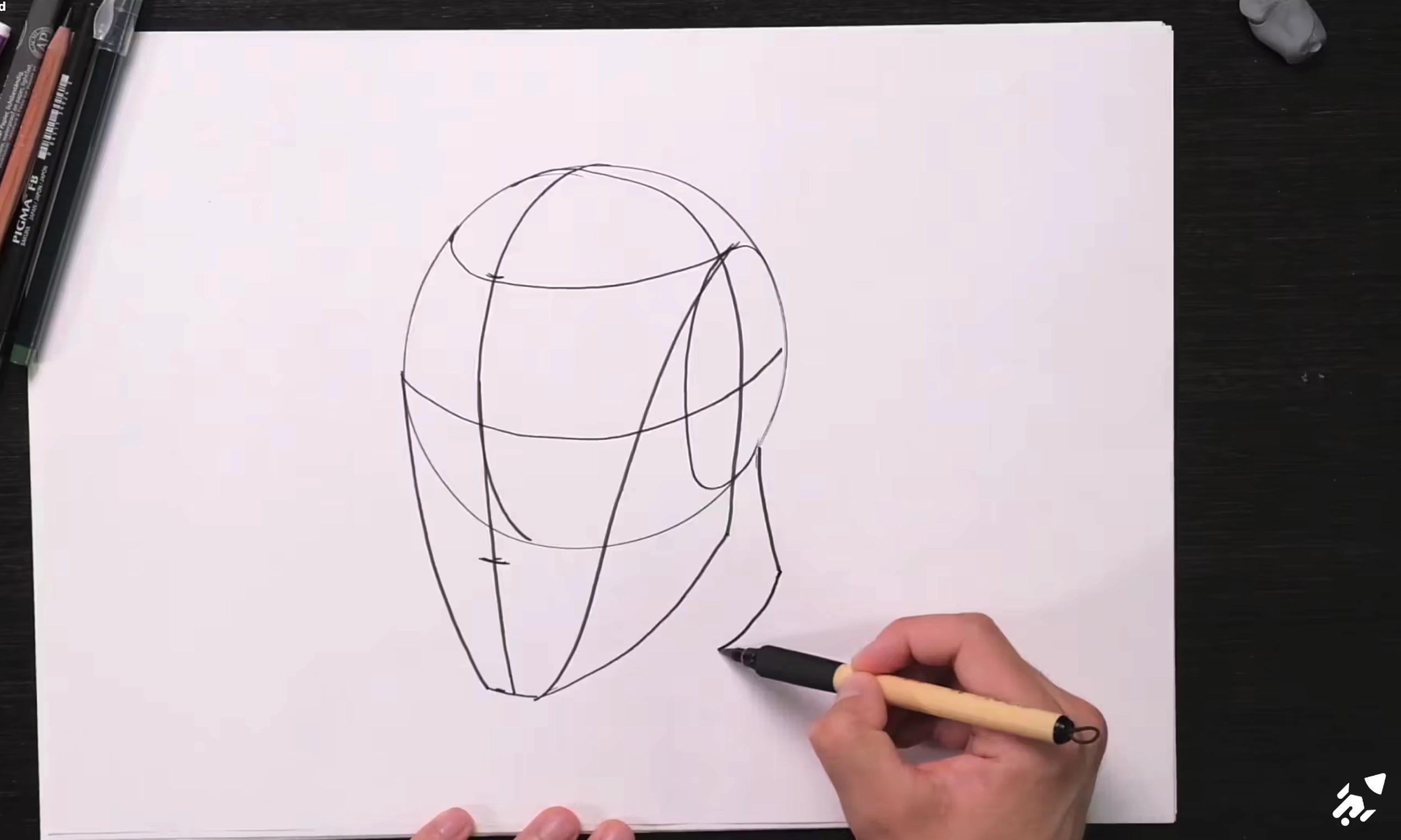 Drawing a simplified head using the Loomis method.